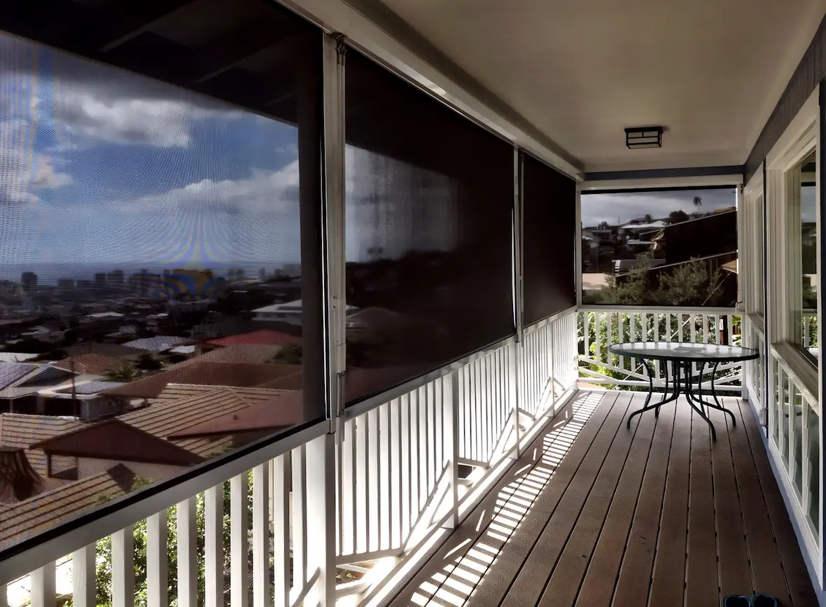 View from porch of city shielded by solar shades