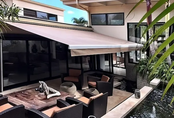 Outdoor padio shaded by a retractable awning.