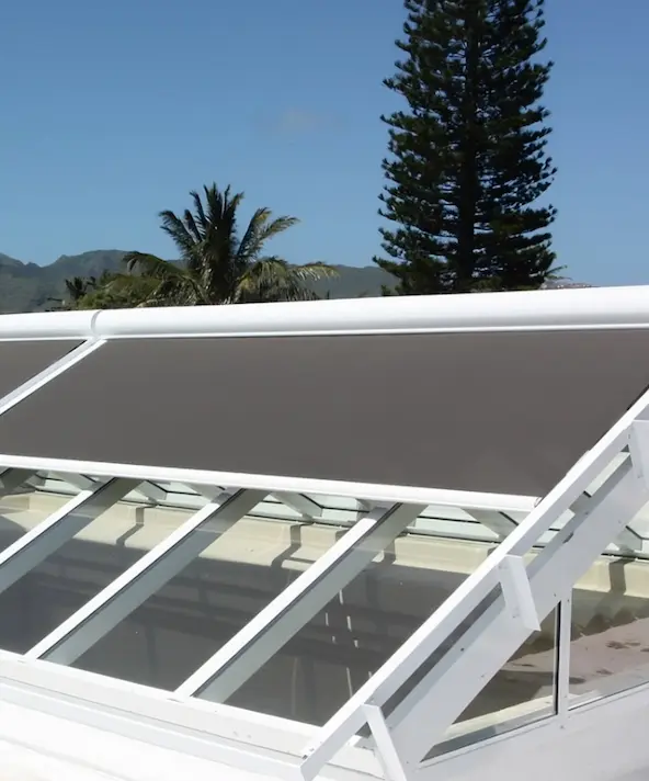 Covered pool enclosed by retractable shutters.